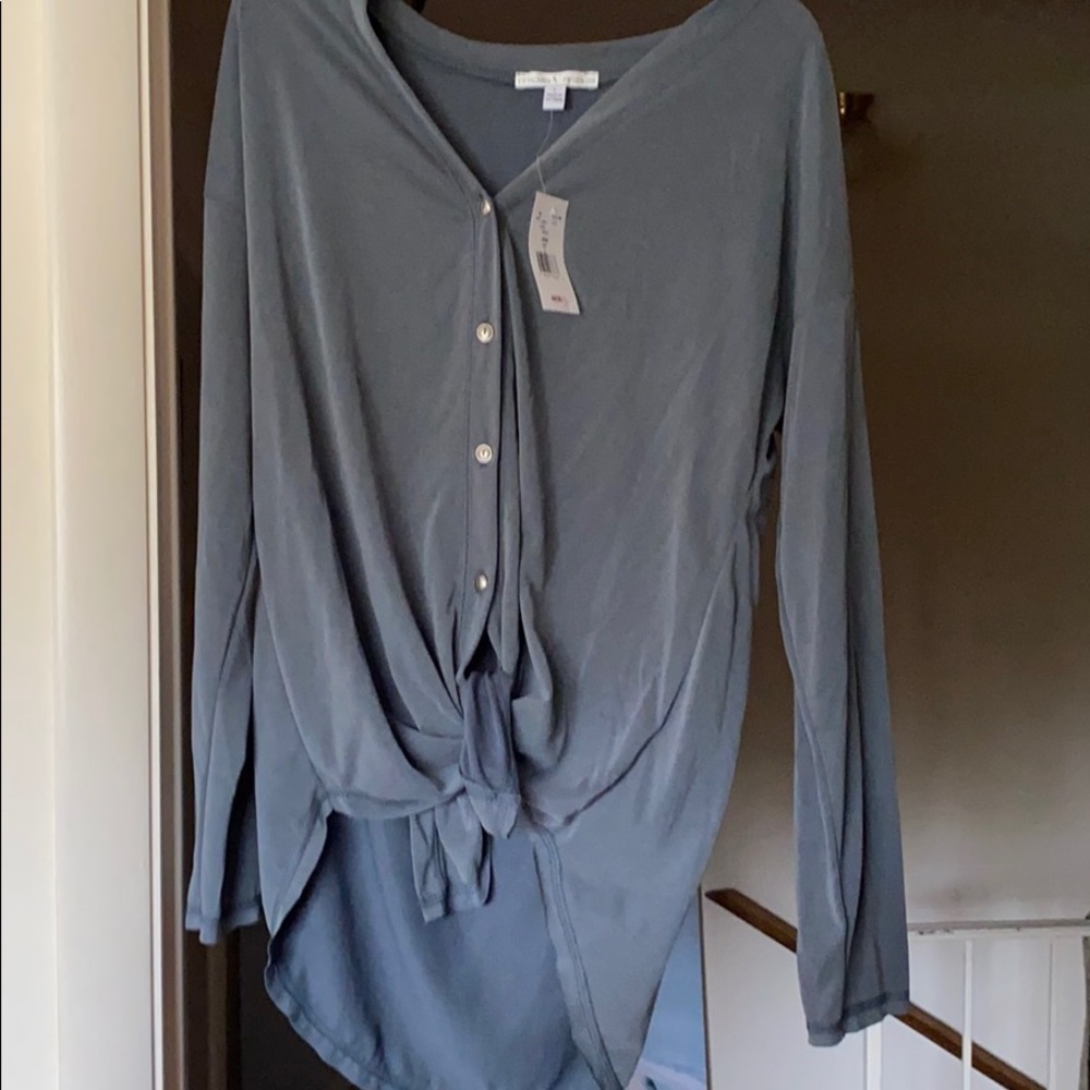 Gray blue high low twist shirt with buttons.